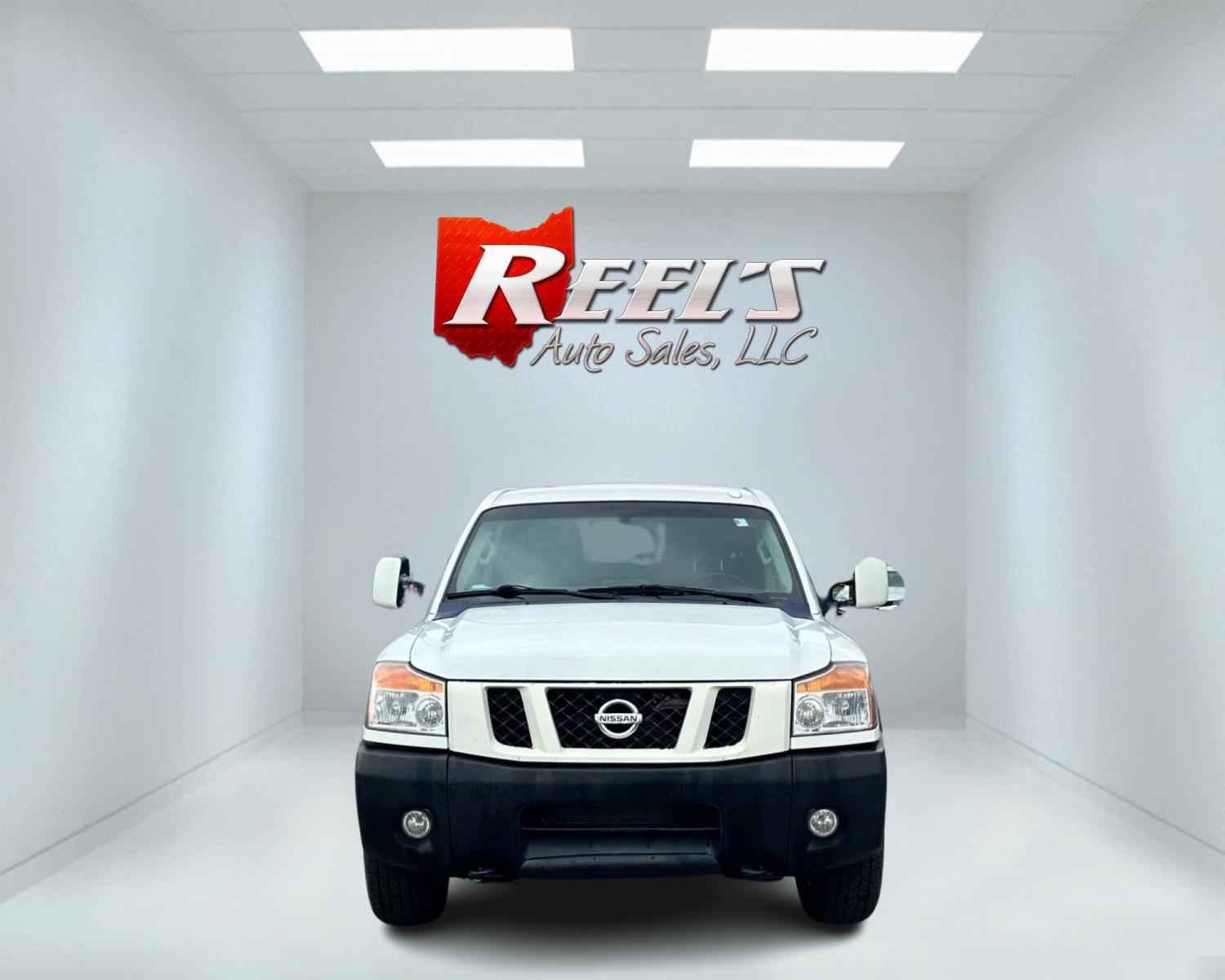 2013 White /Black Nissan Titan Pro-4X (1N6AA0EC0DN) with an 5.6L DOHC 32V V8 engine, Automatic transmission, located at 547 E. Main St., Orwell, OH, 44076, (440) 437-5893, 41.535435, -80.847855 - This 2013 Nissan Titan Pro-4X Crew Cab is a capable and well-equipped full-size pickup truck. It features a powerful 5.6L Endurance V8 engine paired with a 5-speed automatic transmission, a locking rear differential for improved traction, and a maximum towing capacity of 9,300 pounds. The truck is l - Photo #1